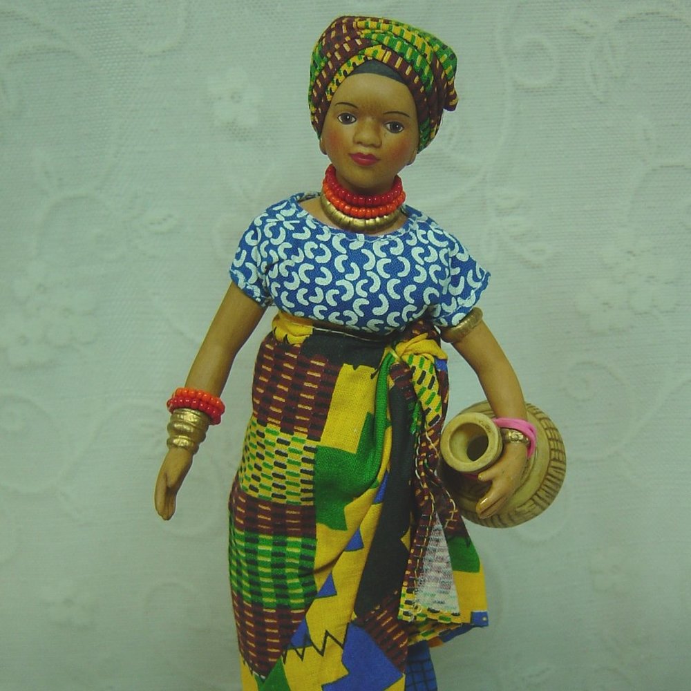 8" porcelain doll--dark skinned native woman carrying water jug - Picture 1 of 7